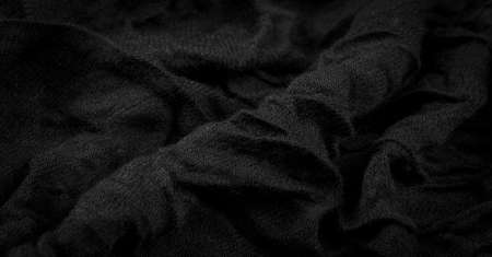 Black rough woolen fabric. Sheep with long, durable, coarse-fiber wool, especially suited to your design. As with various large breeds of lamb of English origin. Texture background patternの写真素材