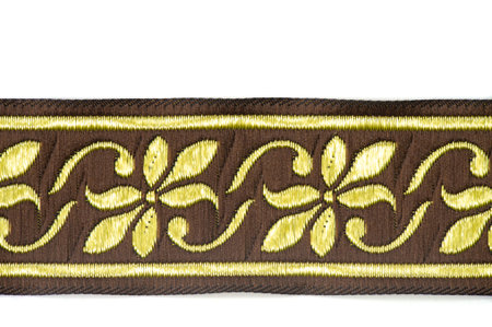 Tape for finishing garments. Trim or trimming in clothing and home decorating is applied ornament, such as gimp, passementerie, ribbon, ruffles, or, as a verb, to apply such ornament.の写真素材