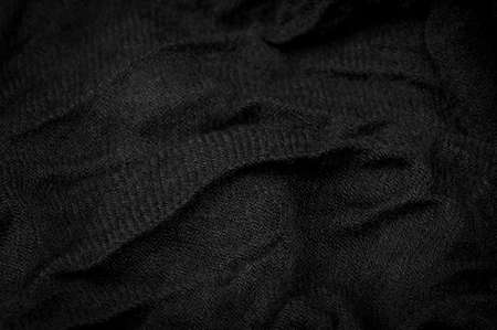 Black rough woolen fabric. Sheep with long, durable, coarse-fiber wool, especially suited to your design. As with various large breeds of lamb of English origin. Texture background patternの写真素材