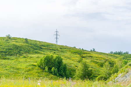 Beautiful summer landscape in Altai. View of the beautiful landscape in Altai With fresh green meadows and peaked mountains in the background on a sunny day. Ust-Kamenogorsk National Park, Kazakhstanの写真素材