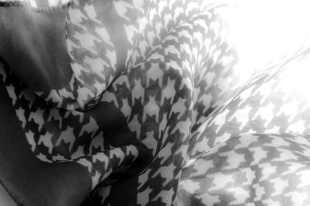 Delicate black and white silk chiffon in bright colors with geometric print. Surprisingly light, smooth, sandy to the touch fabric.の写真素材