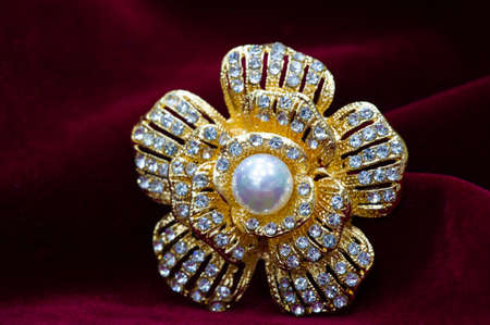 Women's brooch. Accentuate classic glamor with our edition of women's brooches. Embodying elegance, these designer brooches are detailed with crystals, fittings and colorful gems.の写真素材