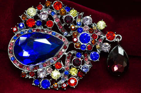 Women's brooch. Accentuate classic glamor with our edition of women's brooches. Embodying elegance, these designer brooches are detailed with crystals, fittings and colorful gems.の写真素材