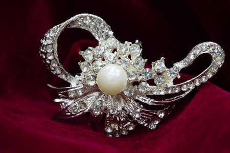 Women's brooch. Accentuate classic glamor with our edition of women's brooches. Embodying elegance, these designer brooches are detailed with crystals, fittings and colorful gems.の写真素材