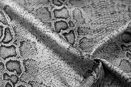 fabric with a pattern of gray snake skin, African fabric, design photo - safari in the country of Africa. Texture, backgroundの写真素材