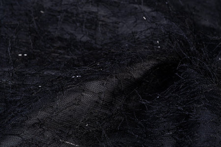 Charcoal black silk fabric with sequins and yarns over the surface of the fabric. This ombre tulle...