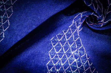 Blue woolen fabric, Woolen shawl with threads on the fabric. This wool print shawl was created especially for the modern woman who knows her mind. Pair this stunning stole with a western suitの写真素材