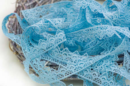 Sky blue lace ribbon. Elegant colorful lace trim, exquisite pattern, suitable for card making, gift wrapping, bow making, jewelry design, flower arrangements, garment accessories, etc.の写真素材