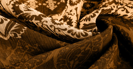 Silk sepia color with floral print and rhombuses. Soft fabric, glossy texture background, satin background, fabric luxury work, elegant pattern, colorful abstract, colorful velvet, macro shredded.の写真素材
