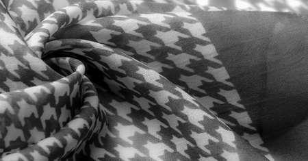 Delicate black and white silk chiffon in bright colors with geometric print. Surprisingly light, smooth, sandy to the touch fabric.の写真素材