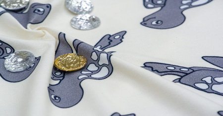Cotton, Jersey. White background with a print of gray turtles. Sew-on rhinestones. Jersey is a plain...