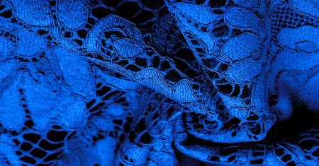 blue lace fabric, delicate embossed lace fabric, scalloped on both edges. Suitable for your projects, design, etc. Texture, backgroundの写真素材