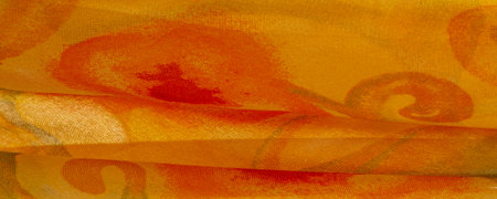 yellow fabric texture with abstract red print. luxury as abstract background. Luxury Christmas background. Fabric, delicate. Smooth elegantの写真素材