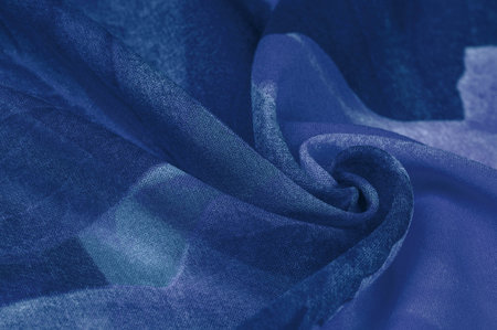silk fabric, women's colored scarf with blue and white flowers. The gorgeous design is based on...