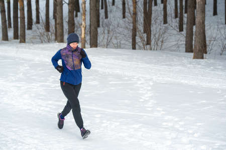 An active lifestyle. Snowboard. bike, skis. race walking. Snow covered the ground. Sunny day. Soon the warm spring sun will melt the winter snows. Russia Naberezhnye Chelny 7 03 2021のeditorial素材