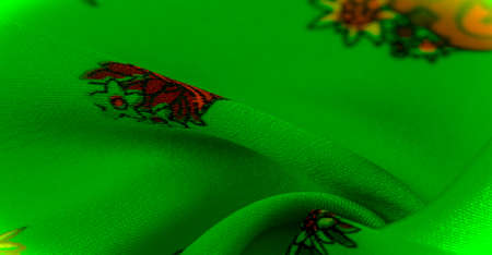 green silk with the print of a shoe in the form of a flowerpot, Organza is a thin, smooth, transparent fabric traditionally made of silk. Textureの写真素材