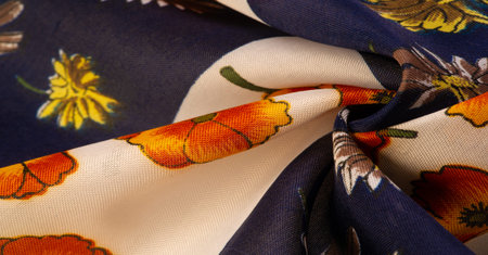 Silk fabric. White and blue squares with floral print. The flowers are red-yellow. Texture...