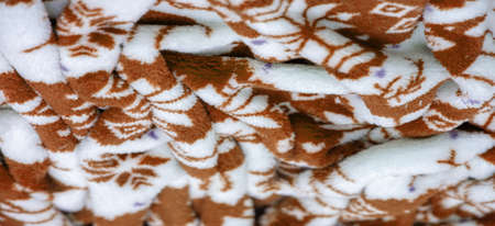 Velvet. Plush. For winter wear. Snow deer, snowflakes. Brown and white tones. Silk fabric with soft, smooth and thick pile. Rich silk clothの写真素材