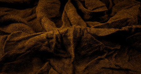 Coarse dark yellow woolen fabric. Sheep with long, durable, coarse-fiber wool especially suited to your design. As with various large breeds of lamb. Texture background patternの写真素材