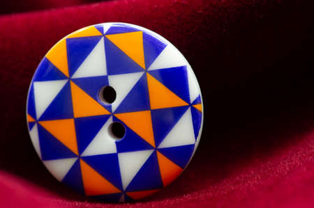 Button. In modern clothing and fashion design, the small clasp button is now most often made of plastic, but can also be made of metal, In archeology it can be an important artifactの写真素材