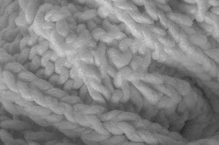 White knitted wool scarf. Large chunky knit. Gorgeous winter handmade wool scarf - Deep snow band - Warm soft white for the neckの写真素材