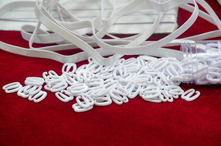 Elastic braid and elastic bands, accessories for sewing lingerie. Text, background, pattern