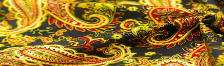 paisley pattern on dark black background. polyester cotton, this is an ornamental textile pattern...