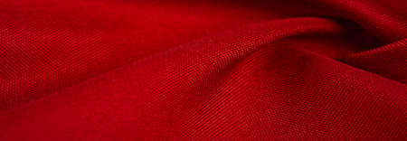 red silk fabric, this is silk satin weaving. Differs in density, smoothness and gloss of the front side, softness, Texture, backgroundの写真素材