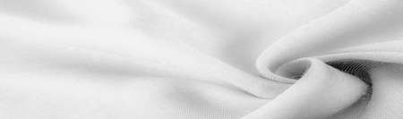 white fabric, twill. Thin fabric with diagonal weaving of threads. From Latin and French, the name of the material is translated Texture, backgroundの写真素材