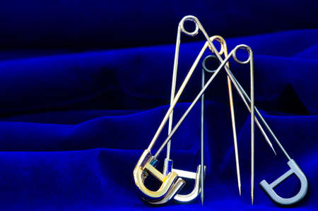 Women's brooch. Accentuate classic glamor with our edition of women's brooches. Embodying elegance, these designer brooches are detailed with crystals, logo fittings and colorful gems.の写真素材