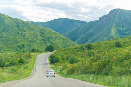Highway paved in the mountains. Ust-Kamenogorsk, Oskemen, Ust-Kaman, Bukhtarma, Kazakhstan 18 07 2021のeditorial素材