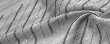 black and white fabric with Lurex stripes, perfect for a fresh and comfortable style. Design backgroundの写真素材