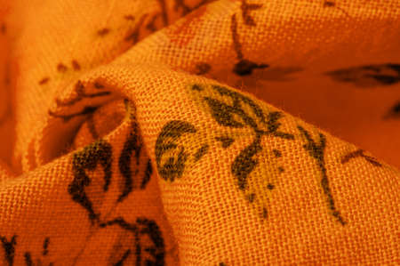Yellow orange cotton fabric with floral print. Buy floral prints from independent artists and iconic brands. Texture, background, pattern,の写真素材