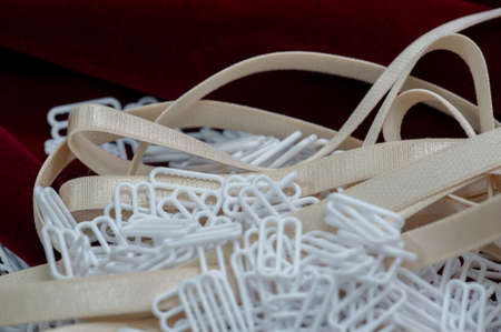 Elastic braid and elastic bands, accessories for sewing lingerie. Text, background, pattern