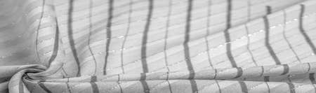black and white fabric with Lurex stripes, perfect for a fresh and comfortable style. texture,の写真素材