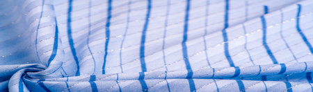 blue fabric with azure and white stripes of lurex, perfect for a fresh and comfortable style....