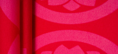 red fabric with abstract flower pattern, taffeta. This is a cotton fabric. Differs in plasticity,...