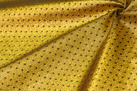Brocade is golden in color. into a little polka. Brocade is a class of ornate shuttle fabrics, often made from colored silk with gold and silver threads. An important fabric in the Renaissanceの写真素材
