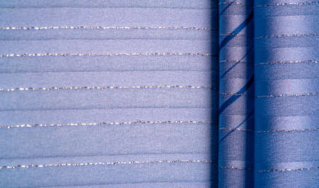 blue fabric with azure and white stripes of lurex, perfect for a fresh and comfortable style. Texture backgroundの写真素材