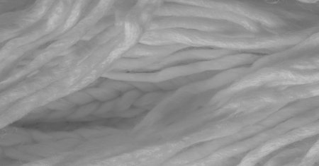 White knitted wool scarf. Large chunky knit. Gorgeous winter handmade wool scarf - Deep snow band - Warm soft white for the neckの写真素材