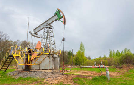 Oil deposit. Pump jacks, which are known as nodding donkeys. Crude oil is found in all reservoirs formed in the earth's crust from the remains of once living creaturesの写真素材