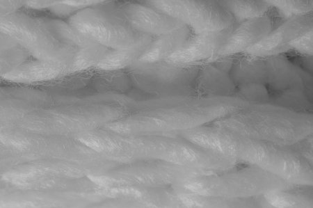 White knitted wool scarf. Large chunky knit. Gorgeous winter handmade wool scarf - Deep snow band - Warm soft white for the neckの写真素材