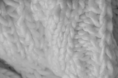 White knitted wool scarf. Large chunky knit. Gorgeous winter handmade wool scarf - Deep snow band - Warm soft white for the neckの写真素材