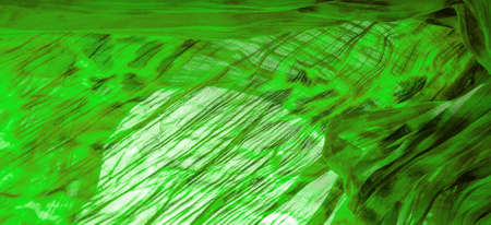 Green cloth. Silk fabric in fine organza with panther print, Crumpled texture. Background. Template.の写真素材