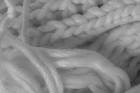 White knitted wool scarf. Large chunky knit. Gorgeous winter handmade wool scarf - Deep snow band - Warm soft white for the neckの写真素材