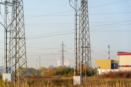 High voltage texture pillar, overhead power line, industrial background. Powerline on the background of the natural beauty of the autumn period.の写真素材
