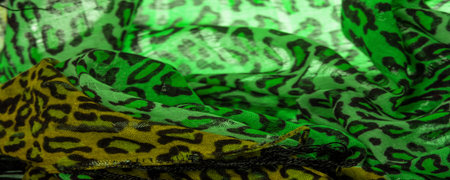 texture, background, pattern, postcard, silk fabric with a print of leopard skin, green color,