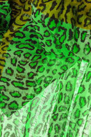 silk fabric green yellow with leopard print. Lightweight leopard print silk is perfect for your design, looks stylish and not vulgar! Texture, background, patternの写真素材