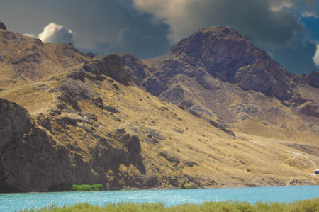 Enjoy the tranquil beauty of the sunset over the calm river. Immerse yourself in majestic mountains...