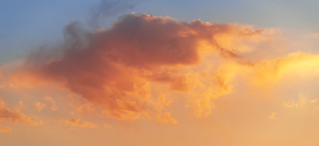 Sunset sky background with tiny clouds. Panoramic image.の写真素材